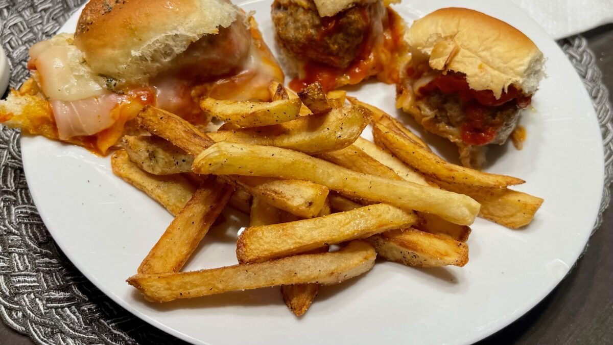 Smoked meatball sliders on a plate with homemade fries